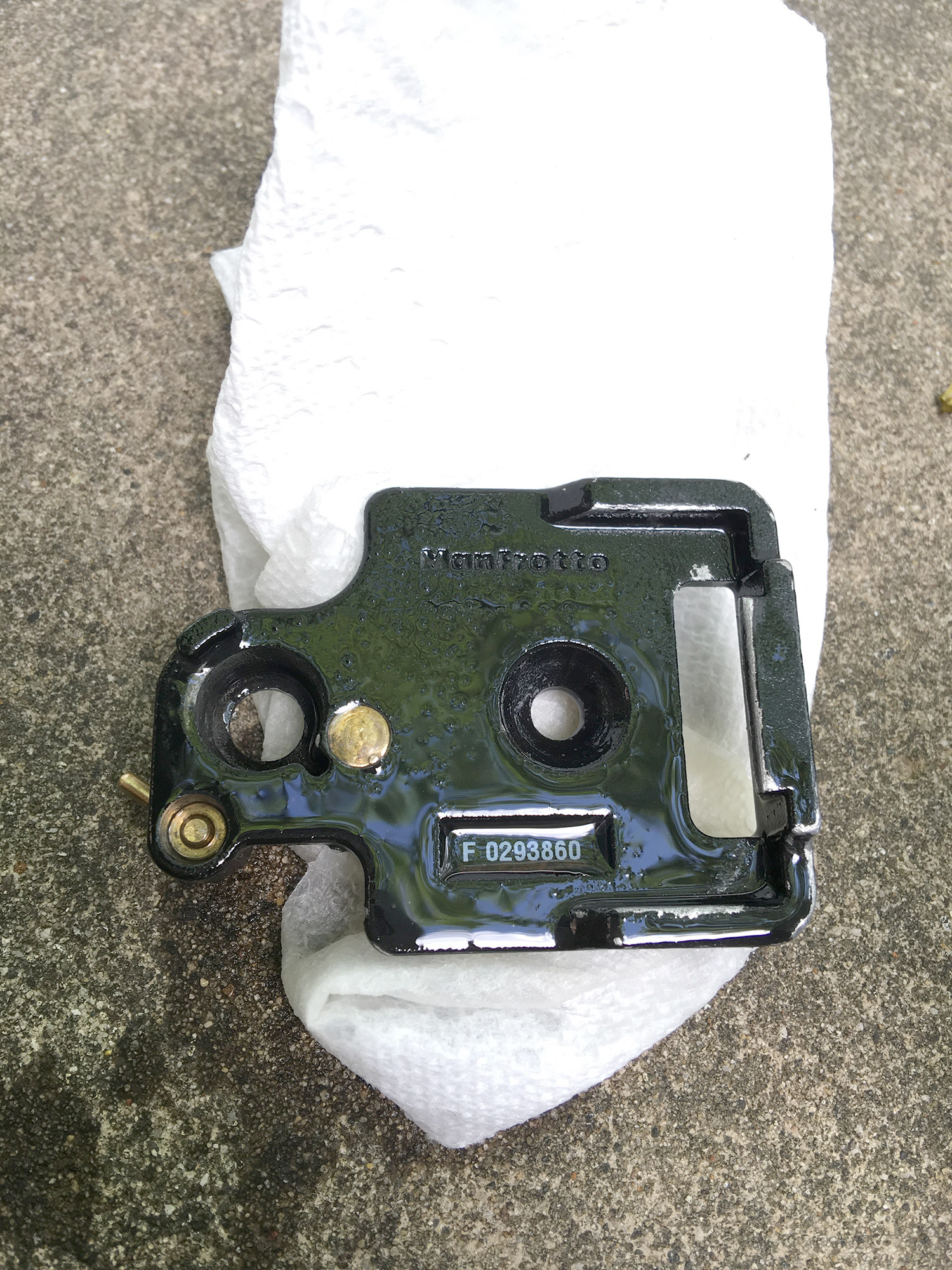 Seized tripod head base plate covered in penetrating oil