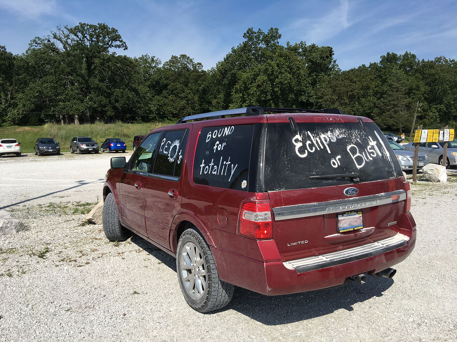 Car covered in writing excited for the eclipse